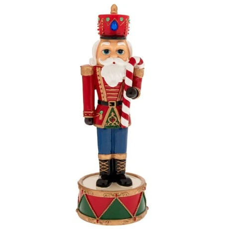 XMAS RED COLOUR RESIN NUTCRACKER ON A DRUM BASE WITH MUSIC AND MOVEMENT 10X10X30CM