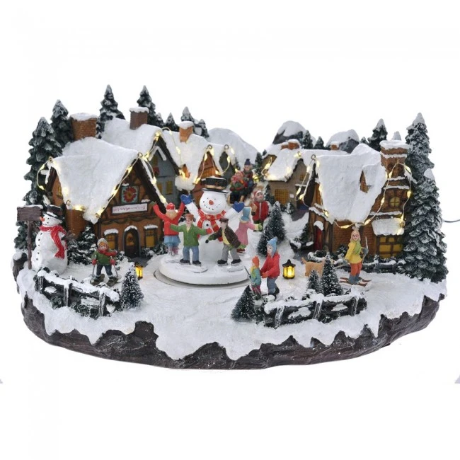CHRISTMAS VILLAGE ANIMATED WITH LIGHTS MUSIC AND A ROTATING SNOWMAN 41X32X21CM