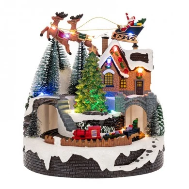 XMAS RESIN LIGHTED VILLAGE WITH MOVING TRAIN 18X18X20CM BATTERY OPPERATED