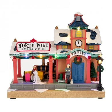 XMAS LIGHTED TRAIN STATION WITH MOVEMENT INCLUDING ADAPTOR 26X15X24CM