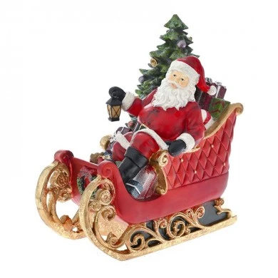 XMAS RED RESIN SANTA SITTING IN SLED WΙΤΗ LED LIGHT 34X19X35CM